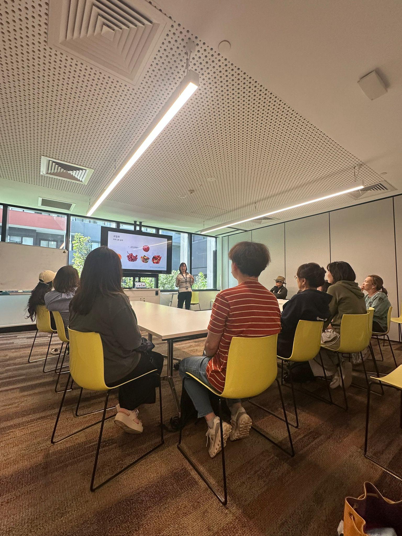 SMULC diabetes prevention and healthy-eating seminar — community health education session with a presenter and attendees